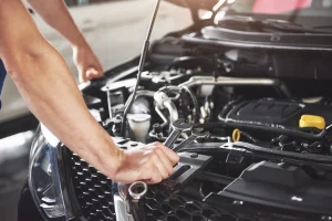 Mechanic’s hands during vehicle maintenance