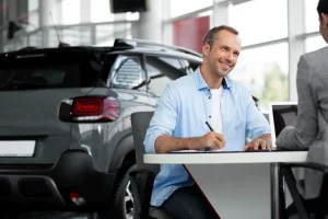 Happy customer at a car dealership