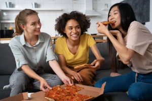 Friends sharing a delivered meal at home
